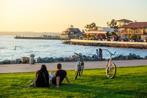 People With Bikes At The Park At Beach 600X400