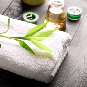 Clean Folded Spa Towel On Graywashed Surface 300X300